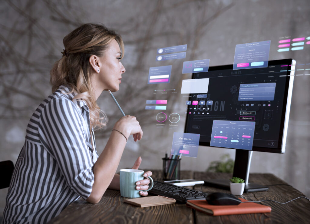 A web designer interacts with futuristic UI/UX elements on a digital interface.