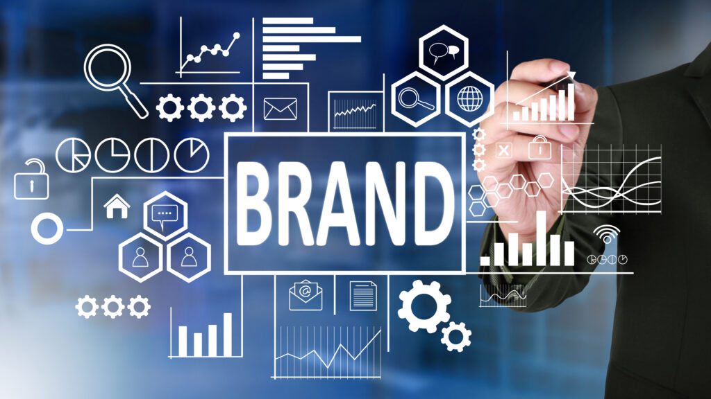 Businessman illustrating brand strategy with digital icons and analytics.