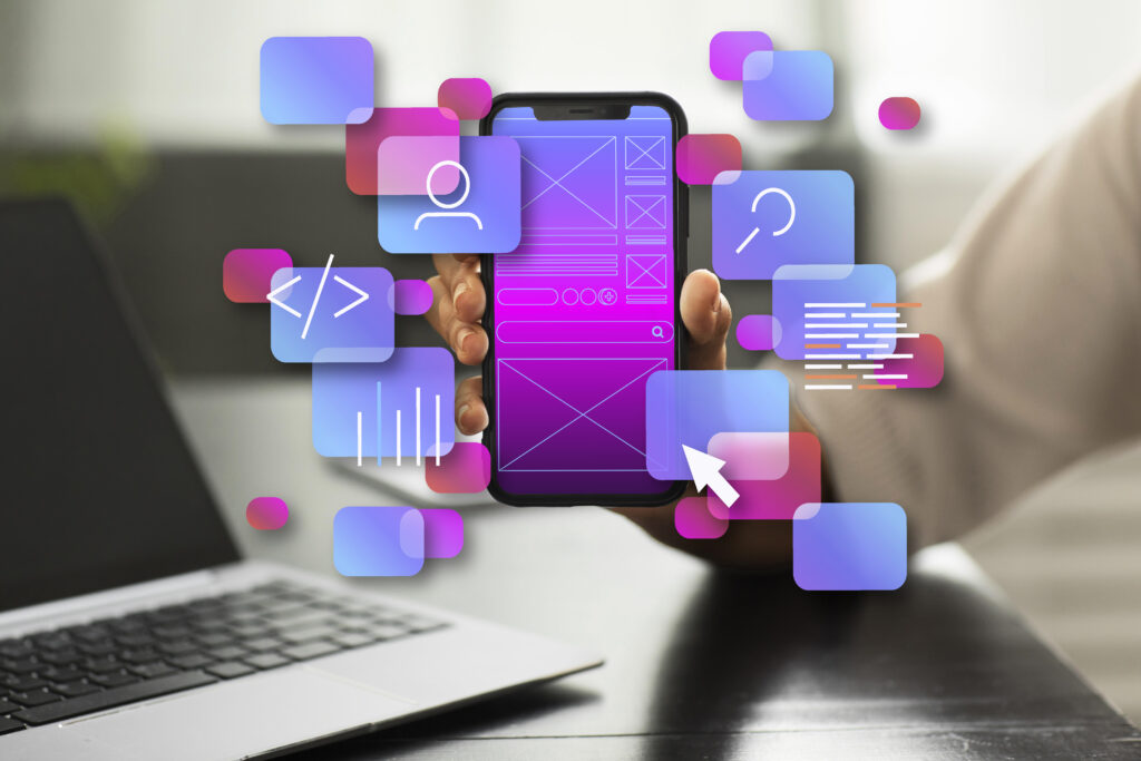 Person holding smartphone with floating UI/UX and coding icons representing app interface design.